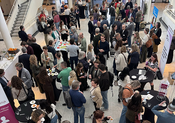 Deelnemers van roadshow Apeldoorn tijdens netwerkbreak